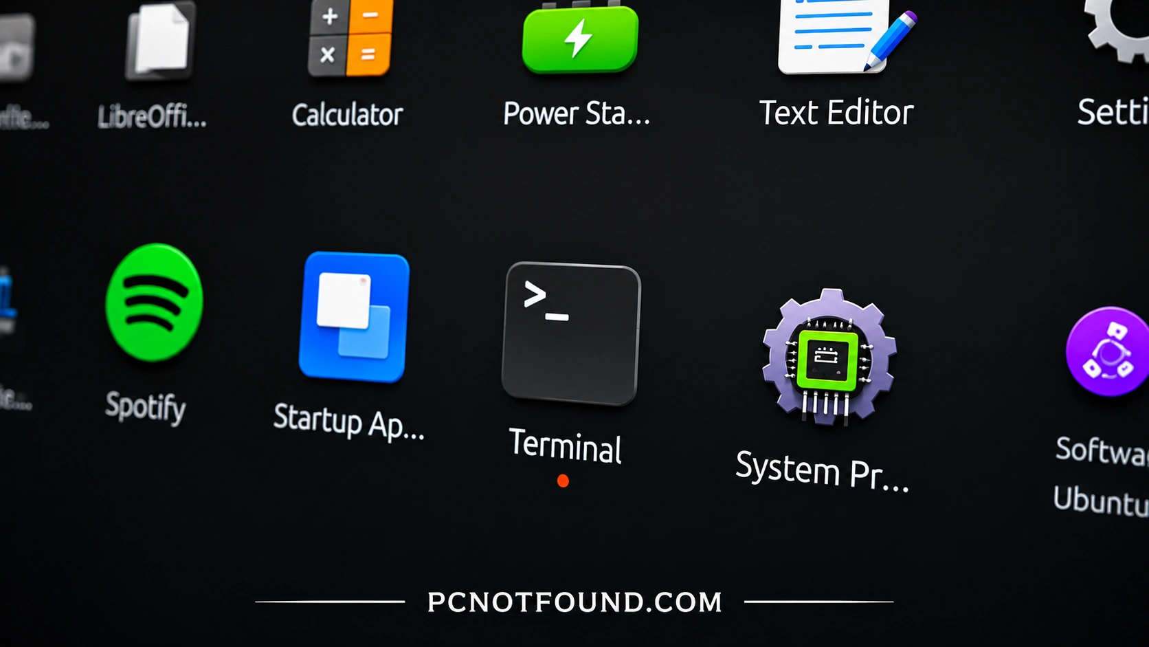 High-resolution Ubuntu Linux desktop application launcher showing Terminal, Spotify, Startup Apps, Calculator, and Text Editor icons with PCNOTFOUND.COM branding at the bottom
